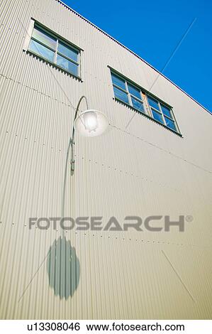 Modern industrial building with outside light View Large Photo Image Stock Photograph - Modern industrial building with outside light. Fotosearch