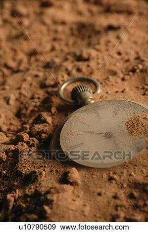 Stock Photo - Old damaged pocket watch. Fotosearch