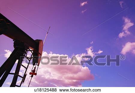 Stock Photo - Part of oil pump against sky. Fotosearch