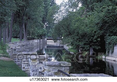 Stock Image - Peaceful stream in a park. Fotosearch