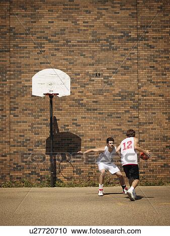 Playing basketball View Large Photo Image Stock Image - Playing basketball. Fotosearch