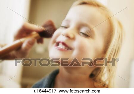 Playing make-up with Mommy View Large Photo Image Stock Photo - Playing make-up with Mommy. Fotosearch