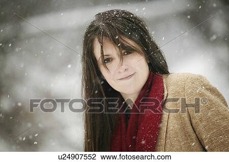 Portrait of a woman standing on a wintery day View Large Photo Image Stock Image - Portrait of a woman standing on a wintery day. Fotosearch