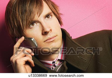 Portrait of man with cell phone View Large Photo Image Stock Photo - Portrait of man with cell phone. Fotosearch