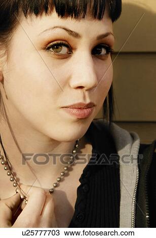 Stock Image - Portrait of young woman. Fotosearch