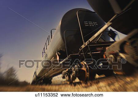 Stock Image - Railway container on railway track. Fotosearch