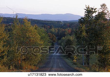 Stock Image - Road through the countryside. Fotosearch
