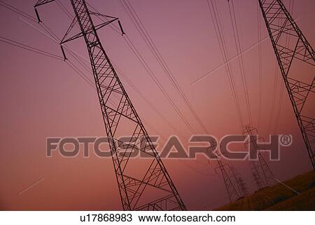 Stock Image - Rows of electricity pylons. Fotosearch