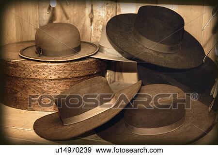 Stock Photo - Selection of old-fashioned hats in sepia tones. Fotosearch
