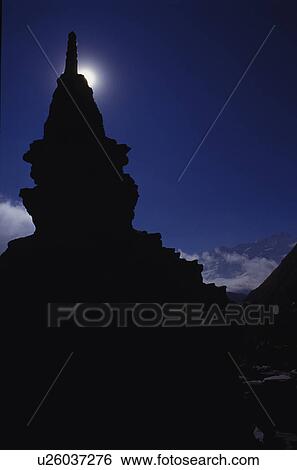 Stock Photograph - Silhouette of tower construction against moon. Fotosearch