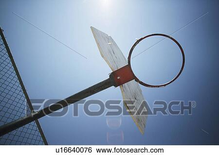 Silhouetted basketball hoop View Large Photo Image Stock Photograph - Silhouetted basketball hoop. Fotosearch