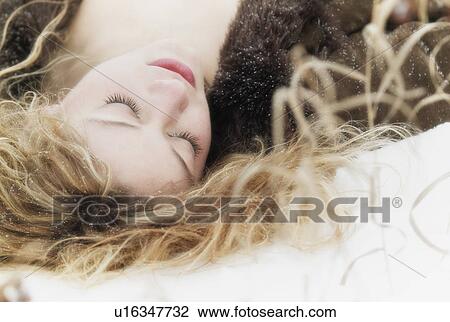 Stock Image - sleeping beauty in the snow. Fotosearch