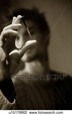 Someone holding old rusty nail View Large Photo Image Stock Image - Someone holding old rusty nail. Fotosearch