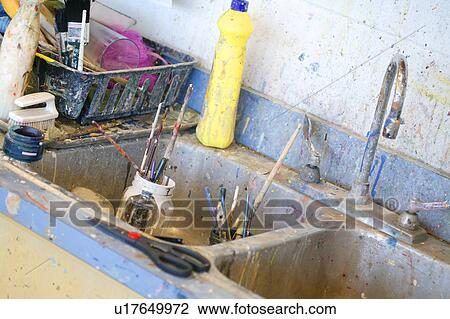 Stock Image - Splattered paint at painting sink. Fotosearch
