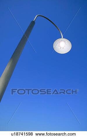 Stock Photo - Street light against clear sky. Fotosearch
