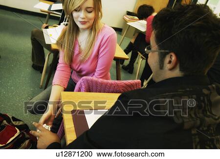 Students passing notes in classroom View Large Photo Image Stock Image - Students passing notes in classroom. Fotosearch