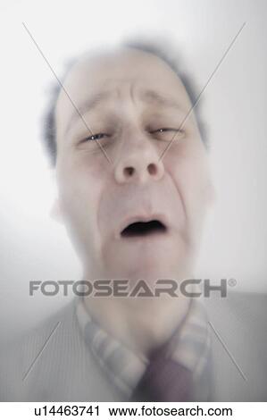 Stock Image - Surreal closeup of older man upset. Fotosearch