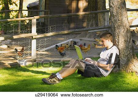 Teen working on lap top View Large Photo Image Picture - Teen working on lap top. Fotosearch