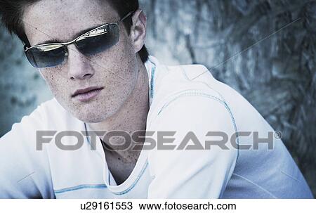 Teenage boy with attitude and wearing shades View Large Photo Image Stock Image - Teenage boy with attitude and wearing shades. Fotosearch
