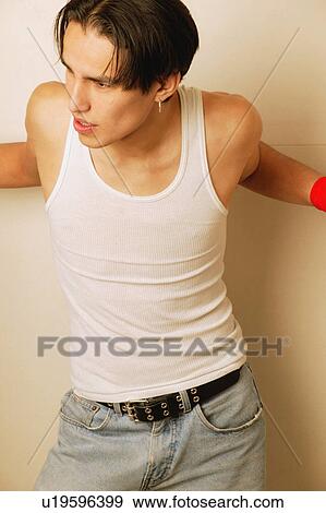 Stock Photo - Teenager in white vest. Fotosearch