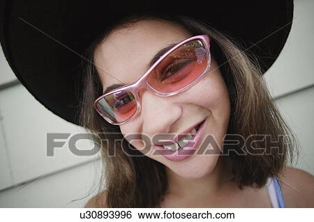 Stock Photograph - Teenager with sunglasses. Fotosearch