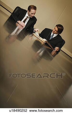 Stock Image - Two businessmen. Fotosearch