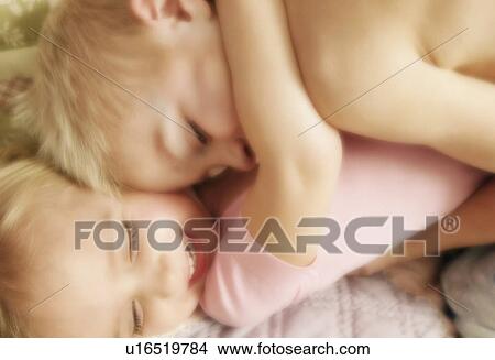 Two children hugging View Large Photo Image Picture - Two children hugging. Fotosearch