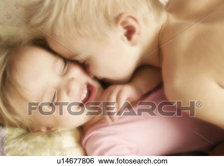 Two children hugging View Large Photo Image Stock Photograph - Two children hugging. Fotosearch