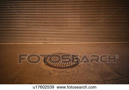 Ventilation grid in the sidewalk View Large Photo Image Stock Photo - Ventilation grid in the sidewalk. Fotosearch