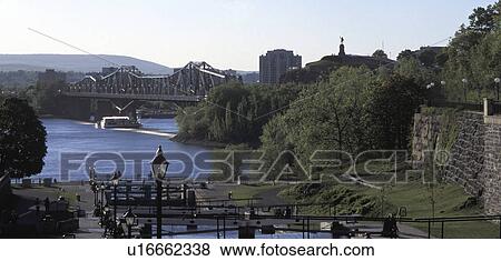 Stock Photo - View of river and bridge. Fotosearch