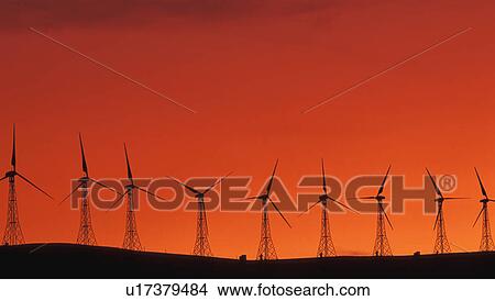 Picture - Wind generators on crest of hill. Fotosearch