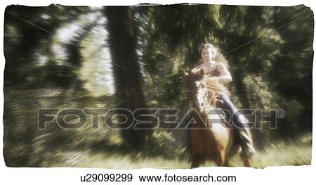 Woman riding horseback View Large Photo Image Stock Photo - Woman riding horseback. Fotosearch