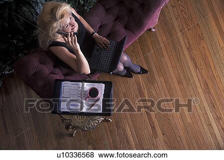 Woman talking on phone View Large Photo Image Stock Photo - Woman talking on phone. Fotosearch