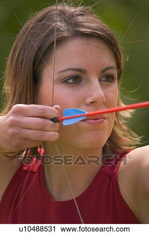 Woman with bow and arrow View Large Photo Image Stock Image - Woman with bow and arrow. Fotosearch
