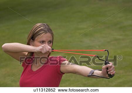 Woman with slingshot View Large Photo Image Stock Image - Woman with slingshot. Fotosearch