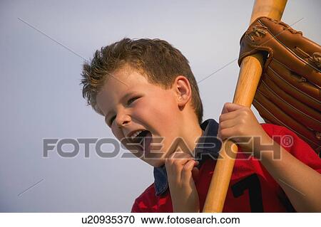 Young boy with a baseball bat View Large Photo Image Stock Image - Young boy with a baseball bat. Fotosearch
