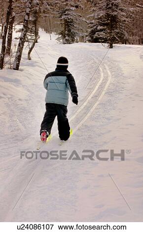 Stock Photo - Young child cross country skiing. Fotosearch