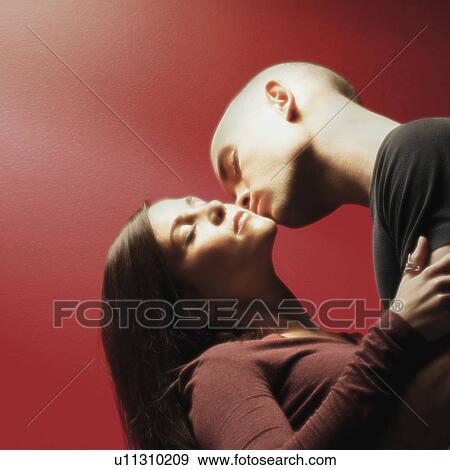 Young couple embracing View Large Photo Image Stock Photo - Young couple embracing. Fotosearch