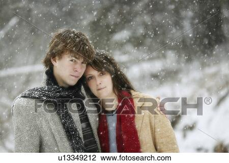 Young couple in the snow View Large Photo Image Stock Image - Young couple in the snow. Fotosearch