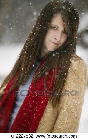 Stock Image - Young woman in the snow. Fotosearch