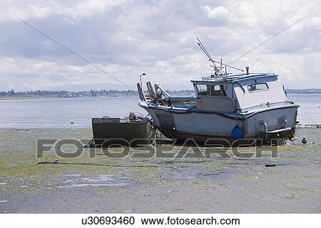 A beached boat View Large Photo Image Stock Image - A beached boat. Fotosearch