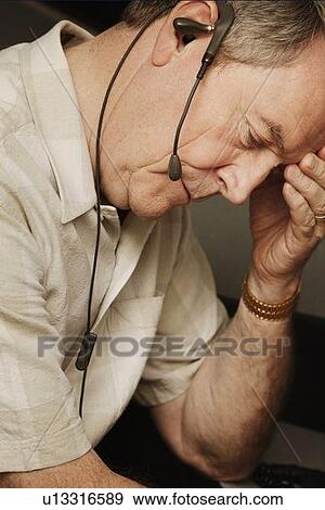 A businessman having a phone conversation View Large Photo Image Stock Photo - A businessman having a phone conversation. Fotosearch