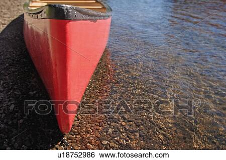 A canoe waits View Large Photo Image Stock Photograph - A canoe waits. Fotosearch