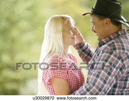 A couple looking at each other View Large Photo Image Stock Image - A couple looking at each other. Fotosearch