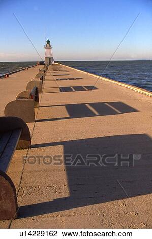 Stock Image - A lighthouse in the distance. Fotosearch