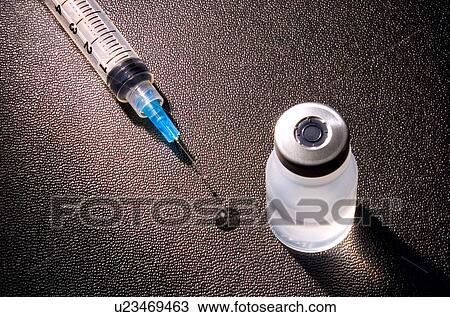 Stock Image - A needle with serum. Fotosearch