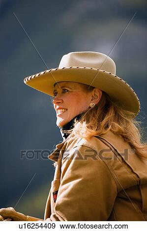 Stock Photo - A portrait of a female rancher. Fotosearch
