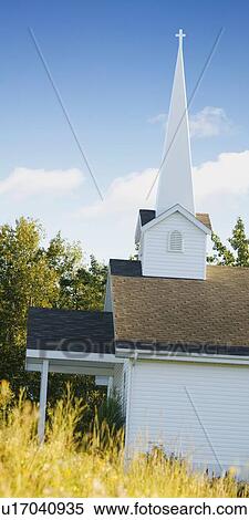 A quaint church with a tall steeple View Large Photo Image Stock Photography - A quaint church with a tall steeple. Fotosearch