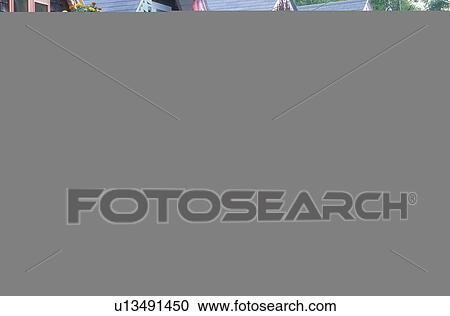 Stock Image - A row of gingerbread wooden houses, Oak Bluffs, Martha's Vineyard, Massachusetts, U. S. A.. Fotosearch