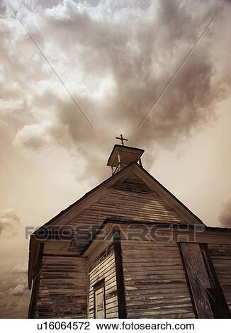 Stock Image - A simple wooden church with cross. Fotosearch